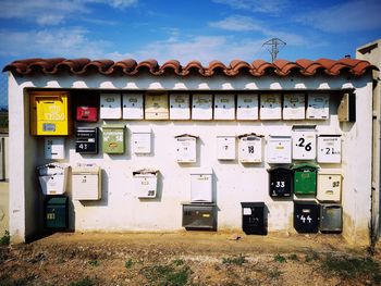 Row of telephone booth against sky
