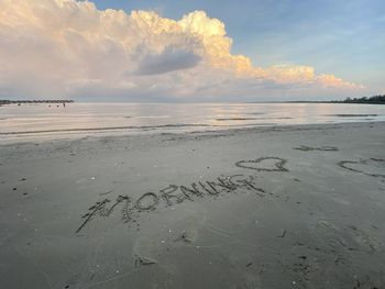 Scenic view of beach against sky during sunset