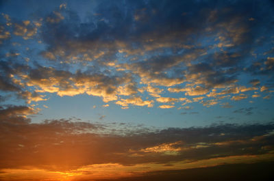 Low angle view of cloudy sky at sunset