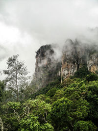 Scenic view of mountains against cloudy sky