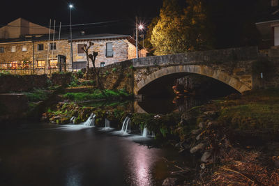 Spanish village bridge and river, at night in autumn. trefacio, zamora. spain