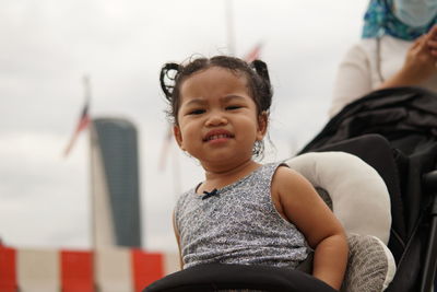 Portrait of cute smiling girl sitting