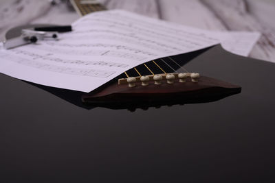 High angle view of guitar on table