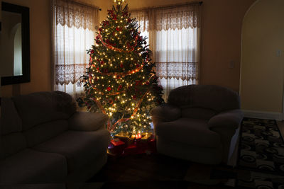 Illuminated christmas tree at home