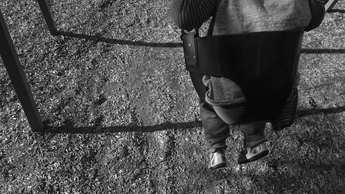 Low section of woman standing on tiled floor