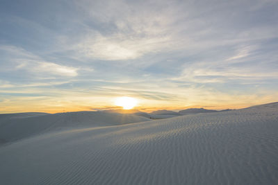 Scenic view of landscape against sky during sunset