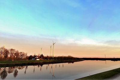 Scenic view of lake at sunset