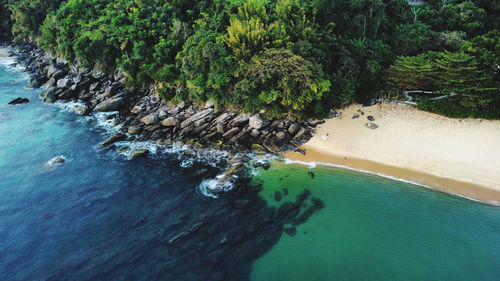 High angle view of rocks by sea