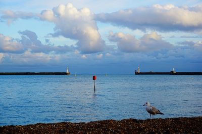 View of calm sea against cloudy sky