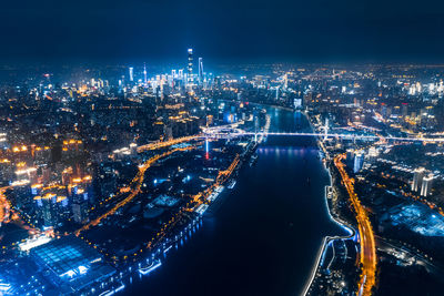High angle view of illuminated city buildings at night