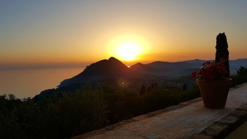 Scenic view of mountains against clear sky during sunset