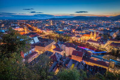 High angle view of illuminated buildings in city