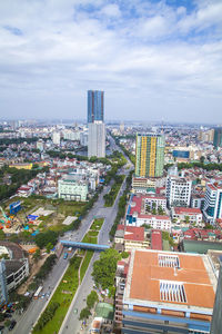 Buildings against cloudy sky