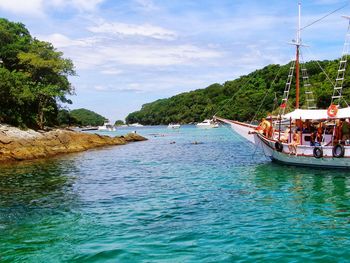 Tourists on boat sailing in sea