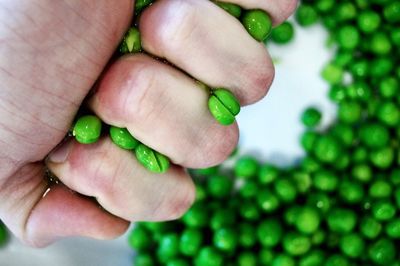 Close-up of hand holding tomato