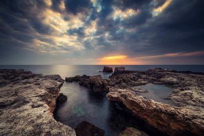 Scenic view of sea against sky during sunset