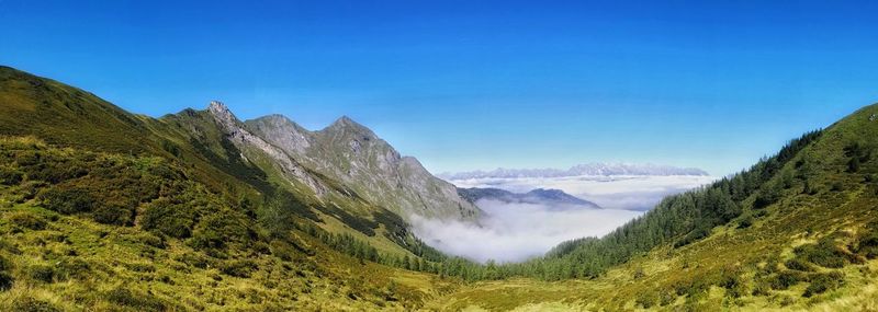 Scenic view of mountains against blue sky tauern weng berge fog