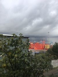 View of residential district against cloudy sky