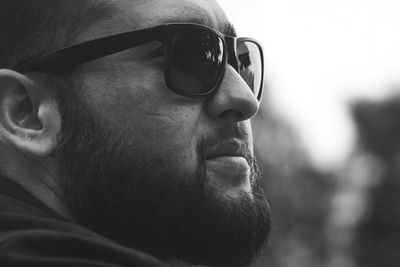 Close-up portrait of man wearing sunglasses