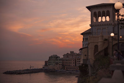 Buildings against sky during sunset