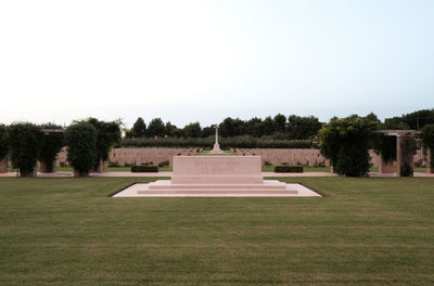 Gazebo on field against clear sky