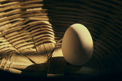 High angle view of eggs in basket on table
