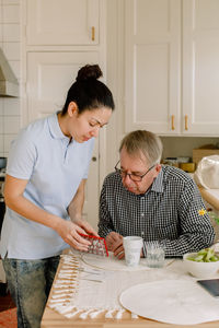 Woman holding food on table