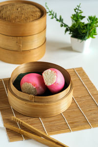 Close-up of apples in basket on table