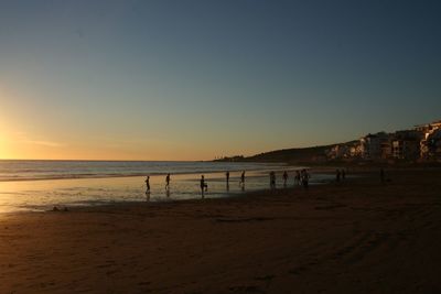 Scenic view of beach against clear sky