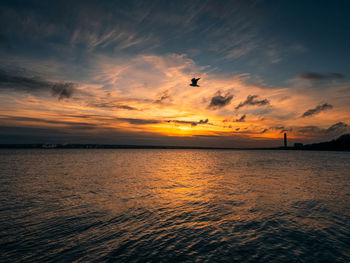 Scenic view of sea against sky during sunset