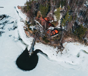 High angle view of frozen trees on snowy field