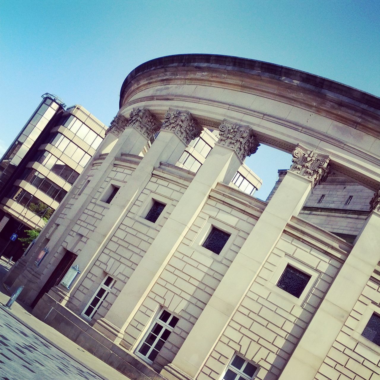 architecture, built structure, building exterior, low angle view, history, window, clear sky, old, sky, city, day, blue, travel destinations, building, outdoors, famous place, arch, no people, architectural feature, tower