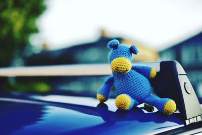 Close-up of stuffed toy on car