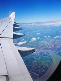 Aerial view of river seen through airplane window