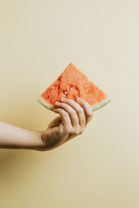 Cropped hand of person holding food