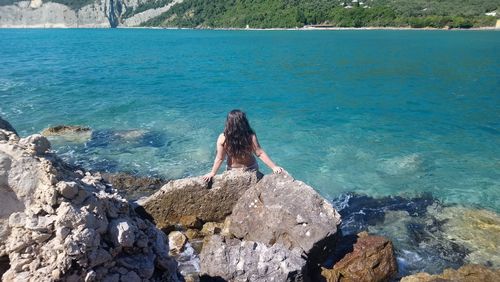 Rear view of woman looking at sea