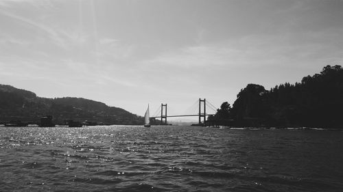 Bridge over sea against sky