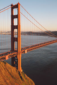 View of suspension bridge against clear sky