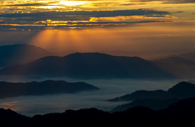 Scenic view at sunset sky during sunrise