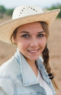 Portrait of smiling woman wearing hat