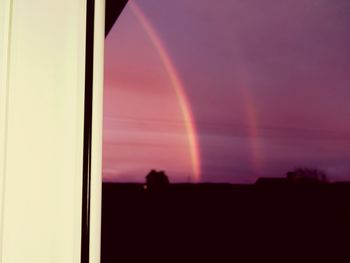 Scenic view of rainbow against sky during sunset