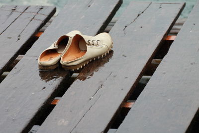 High angle view of shoes on bench