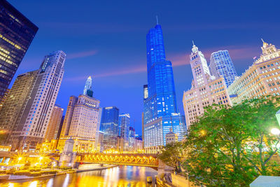 Illuminated buildings in city at night