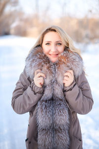 Portrait of young woman in snow