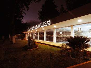 Illuminated information sign at night