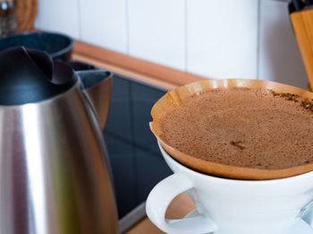 Close-up of coffee cup on table