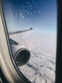 Airplane wing seen through window