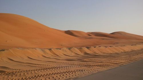 Scenic view of desert against clear sky