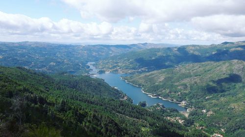 High angle view of green landscape against sky