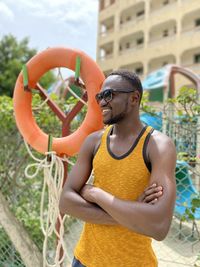 Keyan man poolside in yellow singlet